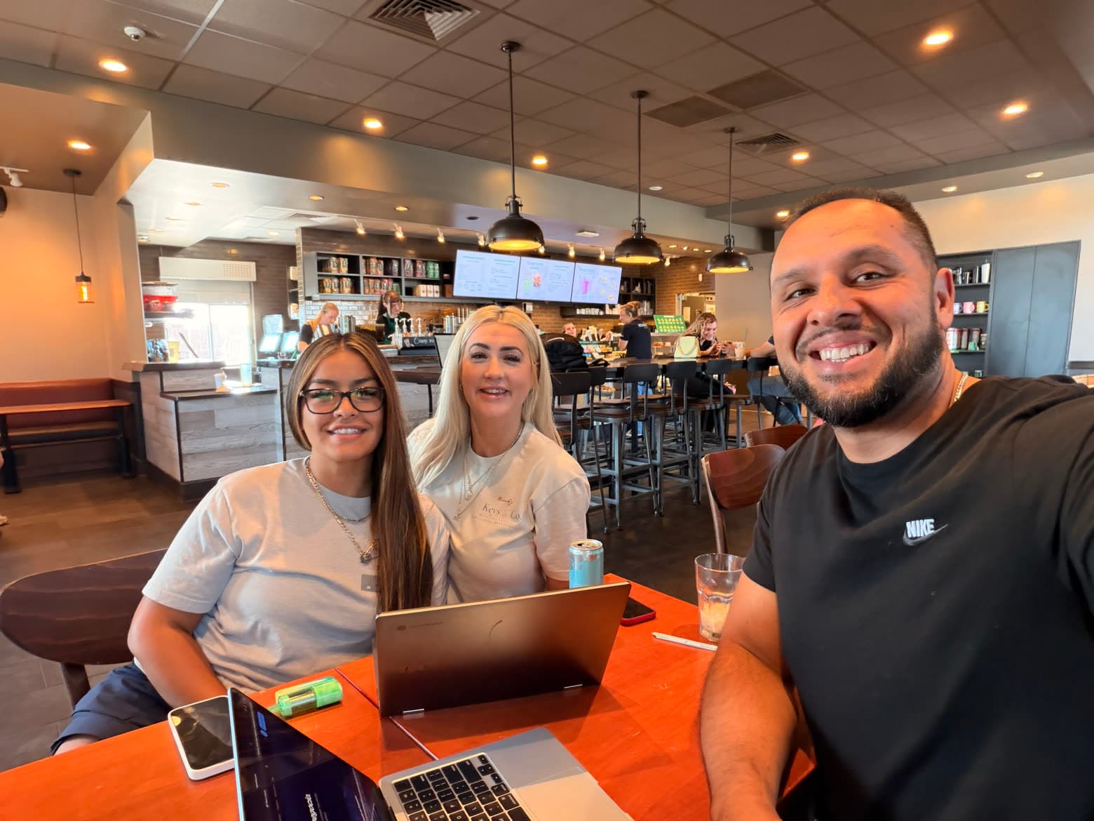 Annalisa Anaya and Misty Dockers of 3 Keys & Co. going over the new website on a laptop with Luis Victoria of LV Growth Co.